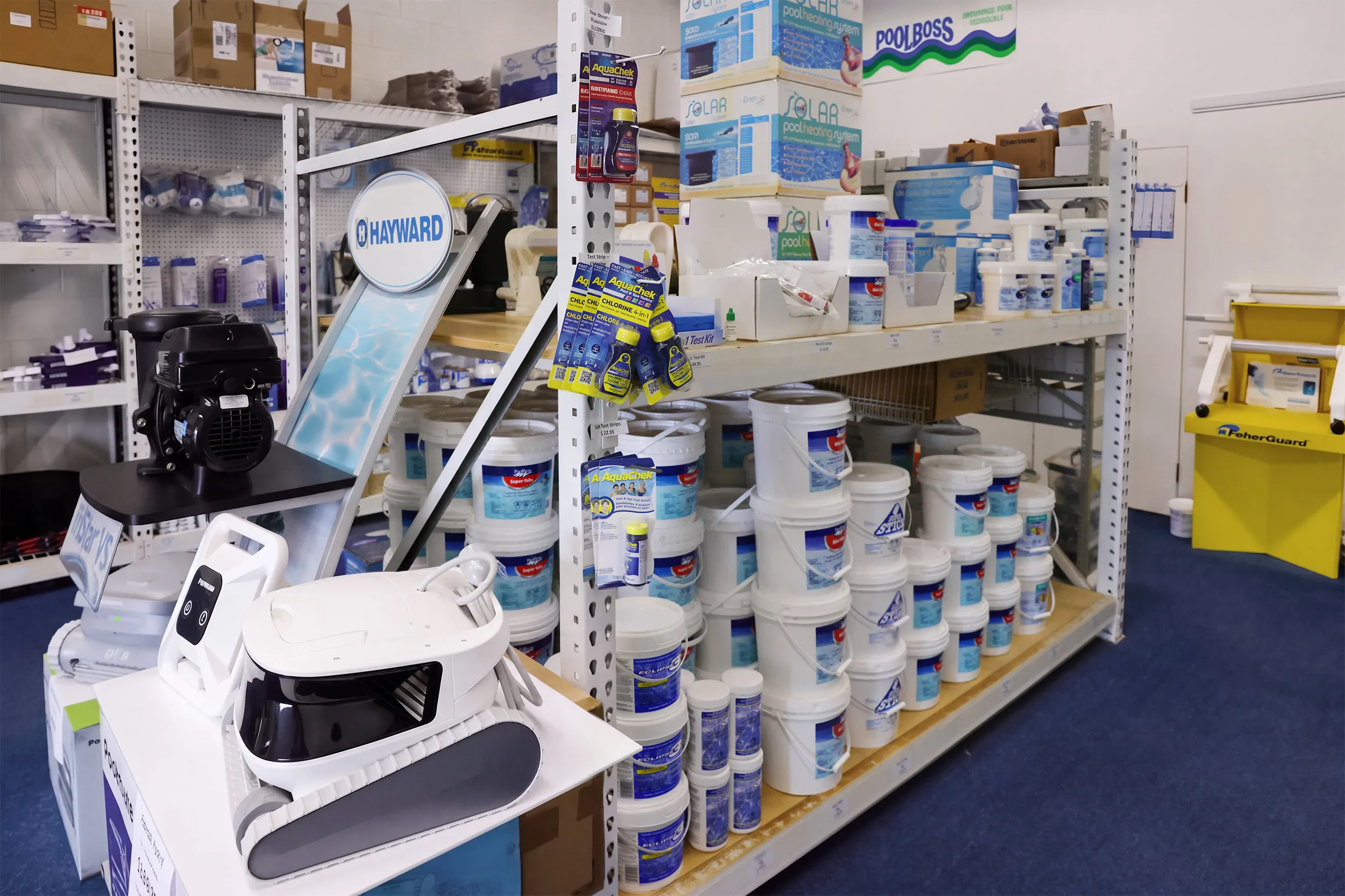 Inside the Aquascapes Store showing pool equipment and inventory