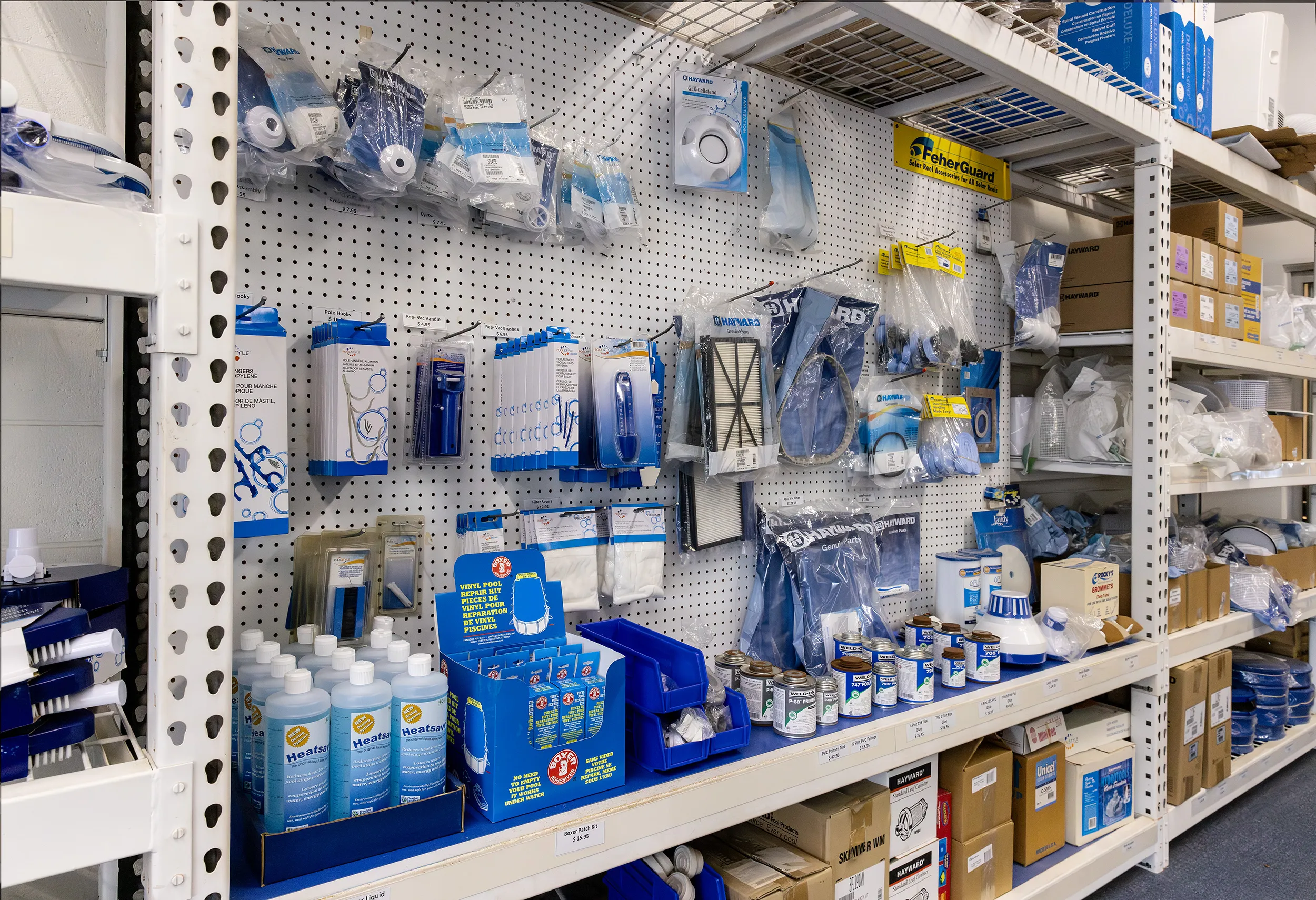 Pegboard wall of replacement parts and filters at the Aquascapes Store