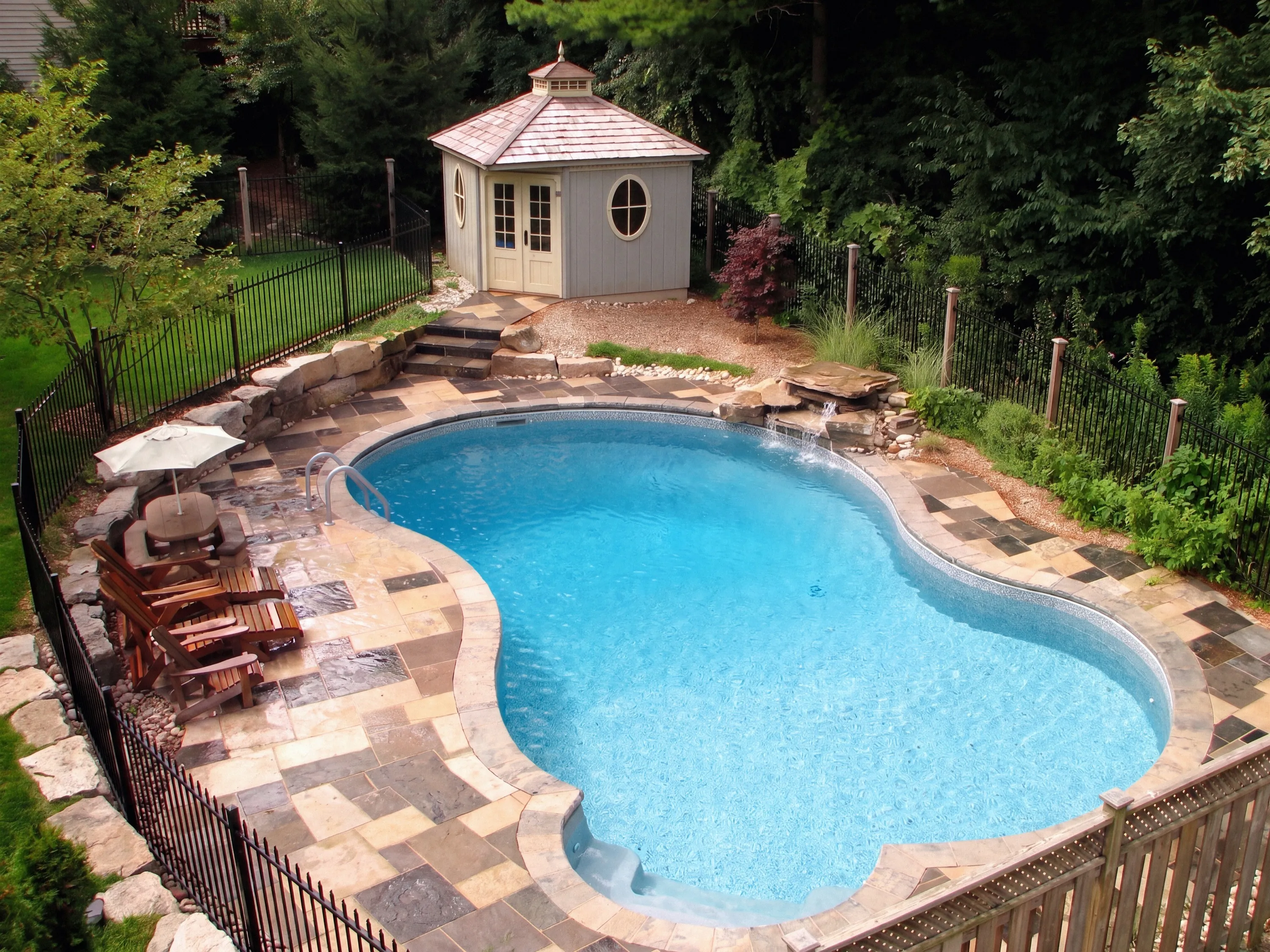 Dominican — rock waterfall, flagstone deck