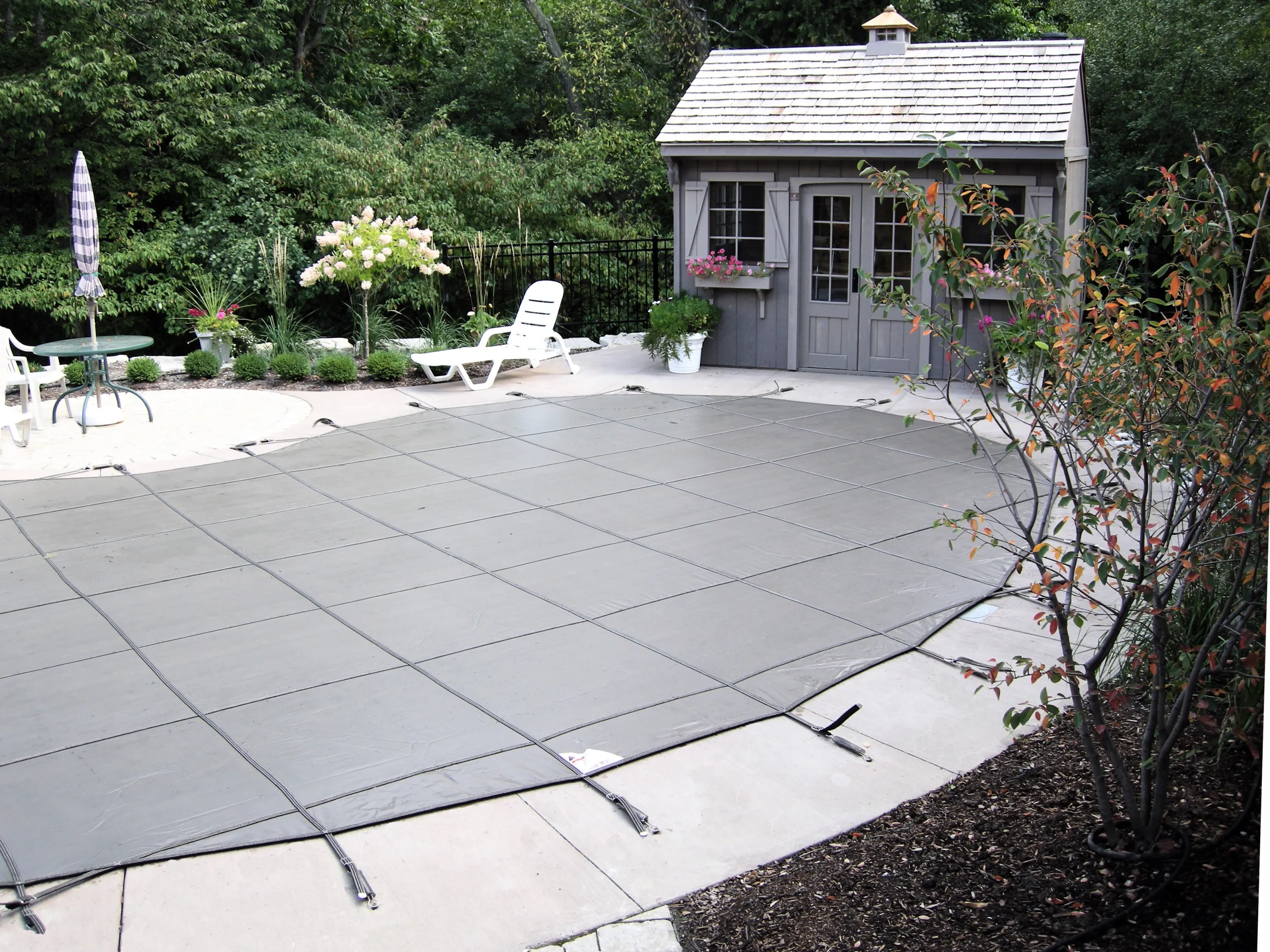 Pool with safety cover installed — Aquascapes Recreational Contractors, Waterloo Region