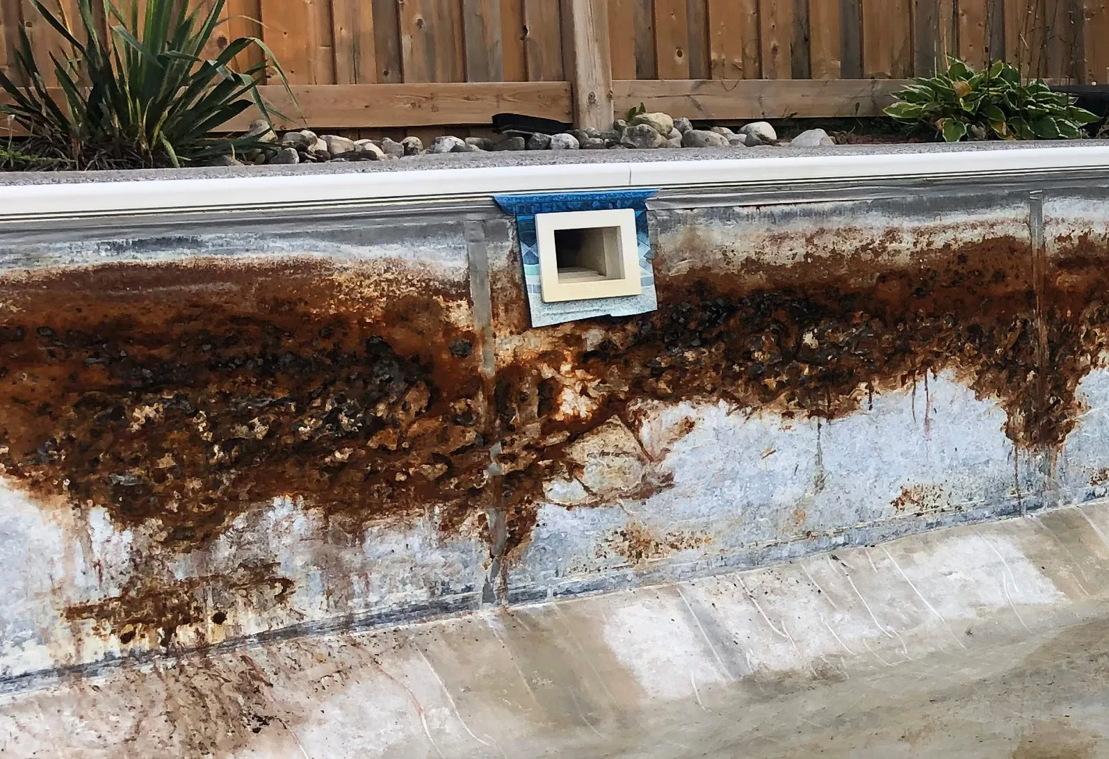 Corroded steel wall panels and return fitting exposed after liner tearout, Aquascapes Recreational Contractors